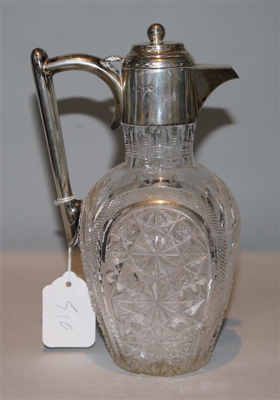 A late Victorian silver mounted cut glass claret jug, Edward Hutton, London, 1890, 23cm.